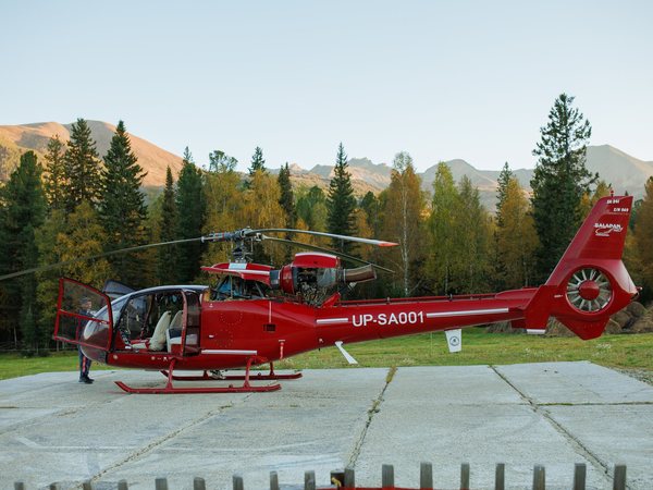 A helicopter on the pad by the base