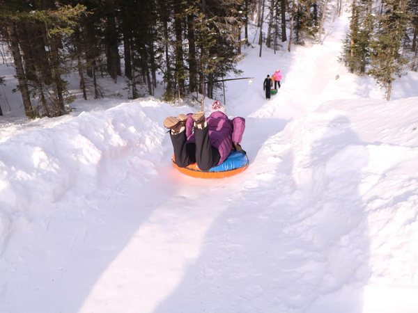 Tubing down the hill in winter